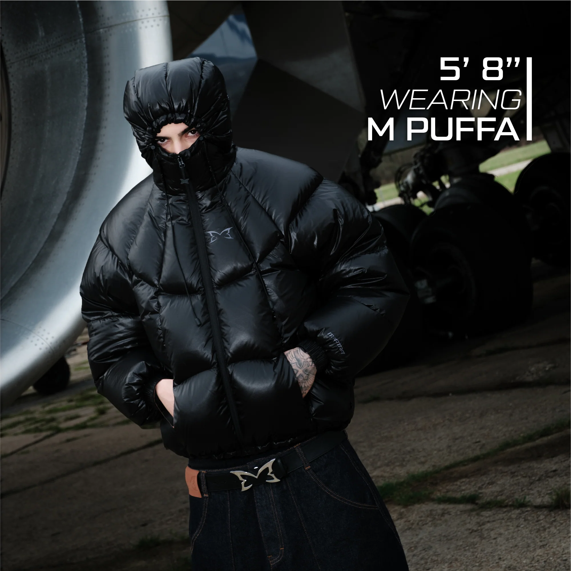 Person wearing a black puffer jacket with text indicating height and product name.